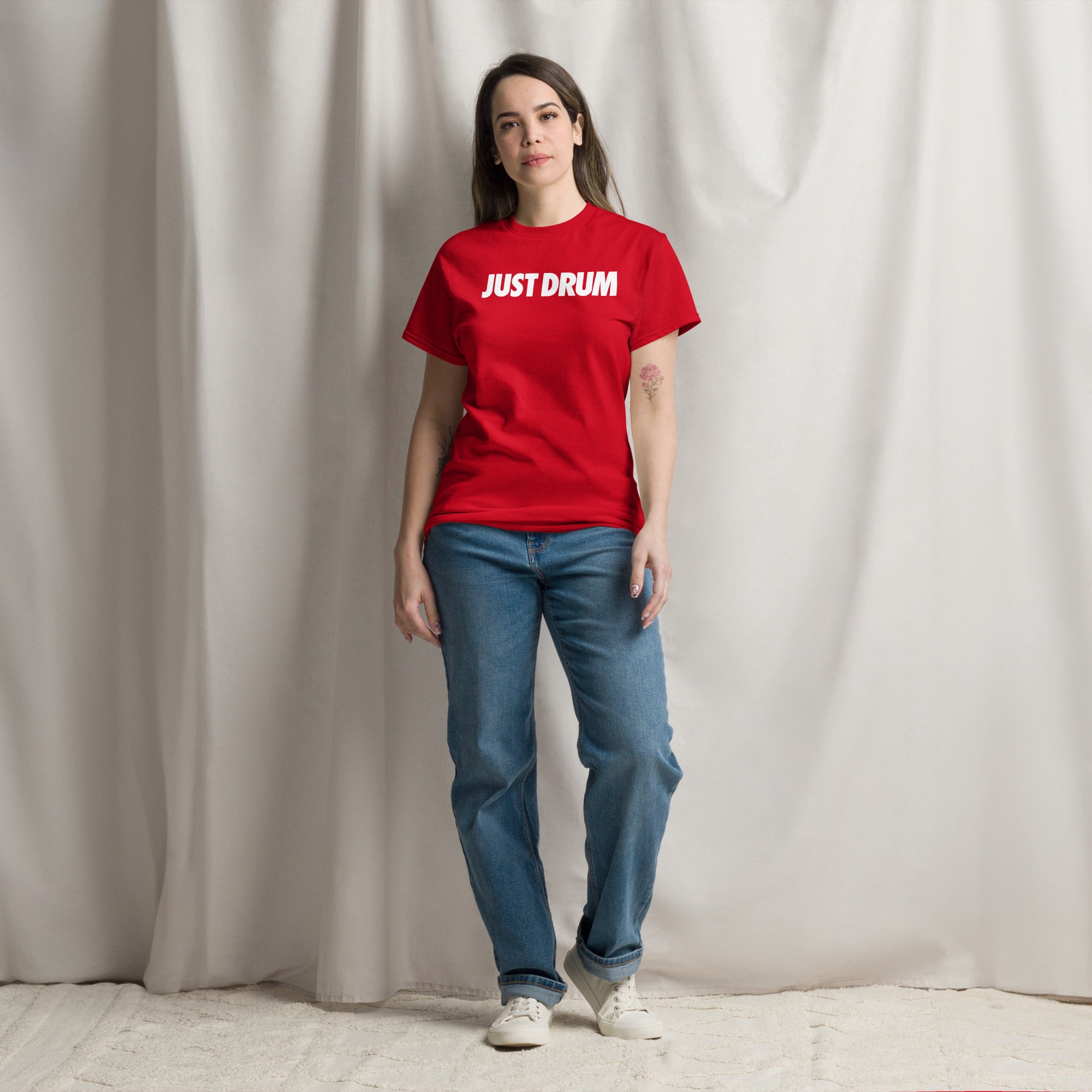 Rep the culture in red. The Drum Club Global Just Drum Tee features a bold JUST DRUM chest print on a premium red unisex tee. The perfect drummer gift. Ships from Nashville, TN.