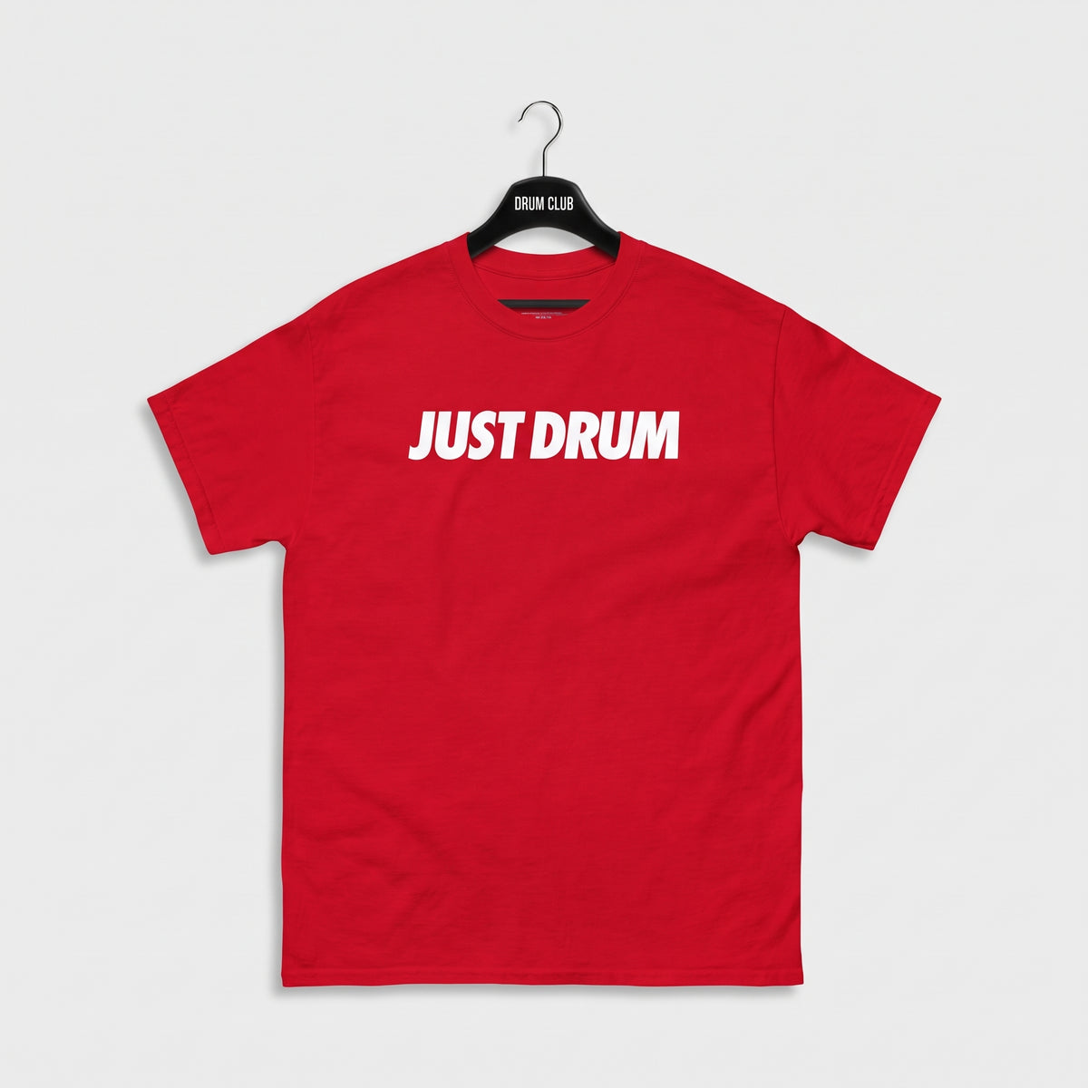 Alternate front view of the red Drum Club T-shirt with white Just Drum lettering.
